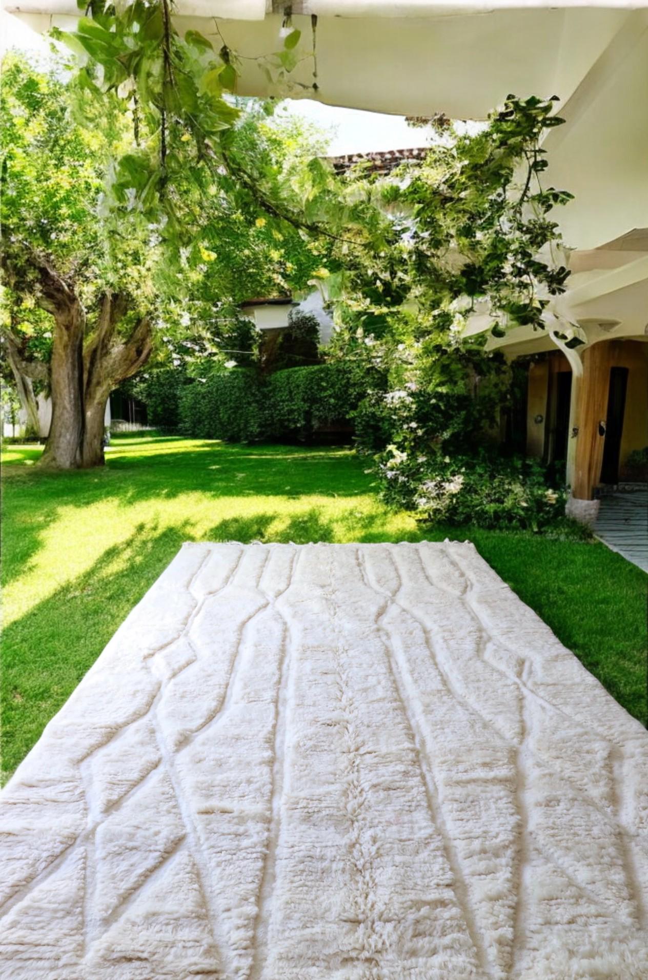 Authentic handmade Moroccan Beni Ourain wool rug in plush cream. Soft, luxurious, and perfect for minimalist, boho, and modern interiors. This high-pile Berber carpet adds warmth and elegance to bedrooms, living rooms, and cozy home spaces. Ethically handwoven.