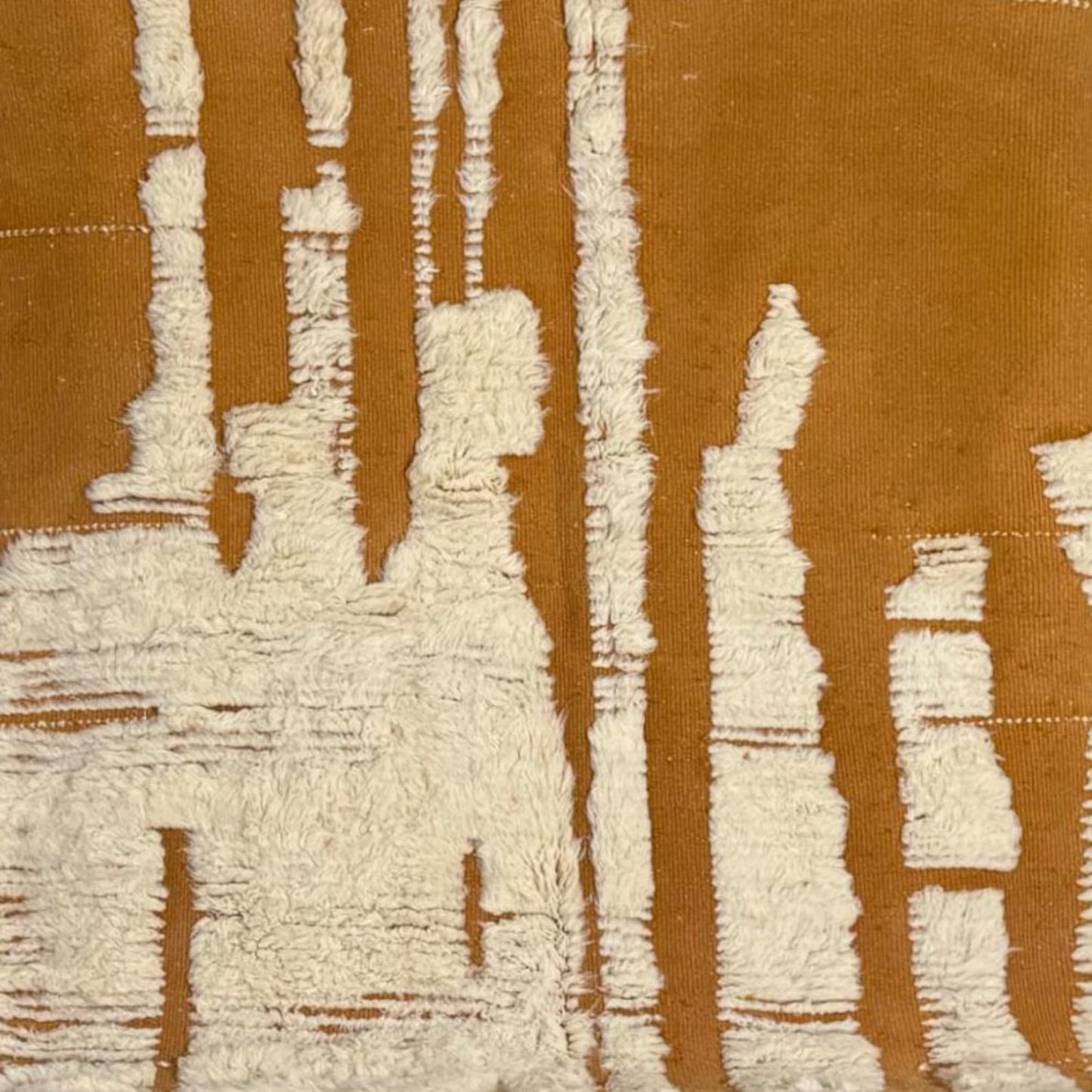 A striking Moroccan wool rug featuring sculpted ivory abstract shapes rising from a deep terracotta base. Handwoven by Amazigh women in the Atlas Mountains using 100% natural wool. This rug blends traditional craftsmanship with a bold, modern design perfect for boho, wabi-sabi, and artistic interiors. Ideal for statement living rooms, studios, or curated spaces.