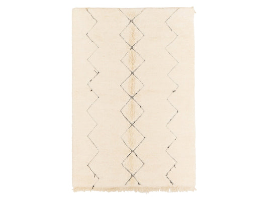 A Moroccan shag rug in cream with a minimalist black diamond pattern, crafted from natural wool. This soft and elegant rug complements modern and traditional interiors and can be customized to any size.
