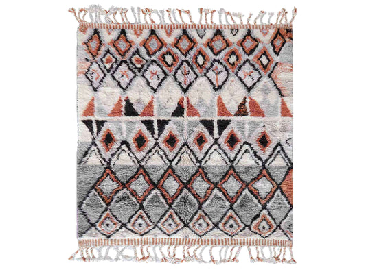 A handmade Moroccan wool rug featuring a sophisticated geometric diamond pattern in neutral tones, orange, and black, accented with intricate details and tassels on the edges. This rug blends traditional Berber craftsmanship with modern interior design styles.