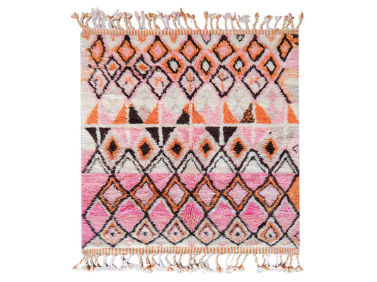 A handmade Moroccan wool rug featuring a vibrant geometric diamond pattern in shades of pink, orange, and black, with intricate detailing and tassels on the edges. A perfect blend of traditional Berber artistry and modern design aesthetics.