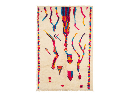 A vibrant Moroccan Boucherouite rug with a bold, colorful abstract pattern on a cream background. Made from natural wool, this rug adds energy and character to bohemian and eclectic interiors and is available in custom sizes.
