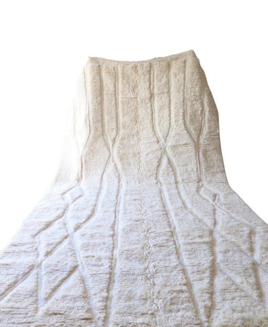 Authentic handmade Moroccan Beni Ourain wool rug in plush cream. Soft, luxurious, and perfect for minimalist, boho, and modern interiors. This high-pile Berber carpet adds warmth and elegance to bedrooms, living rooms, and cozy home spaces. Ethically handwoven.
