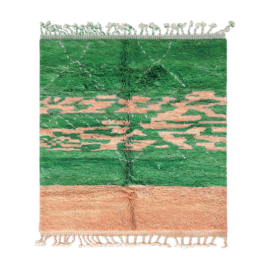 Handmade wool rug with a vibrant green base, adorned with warm peach accents in an abstract design, complemented by a delicate fringe border, ideal for nature-inspired and eclectic decor.