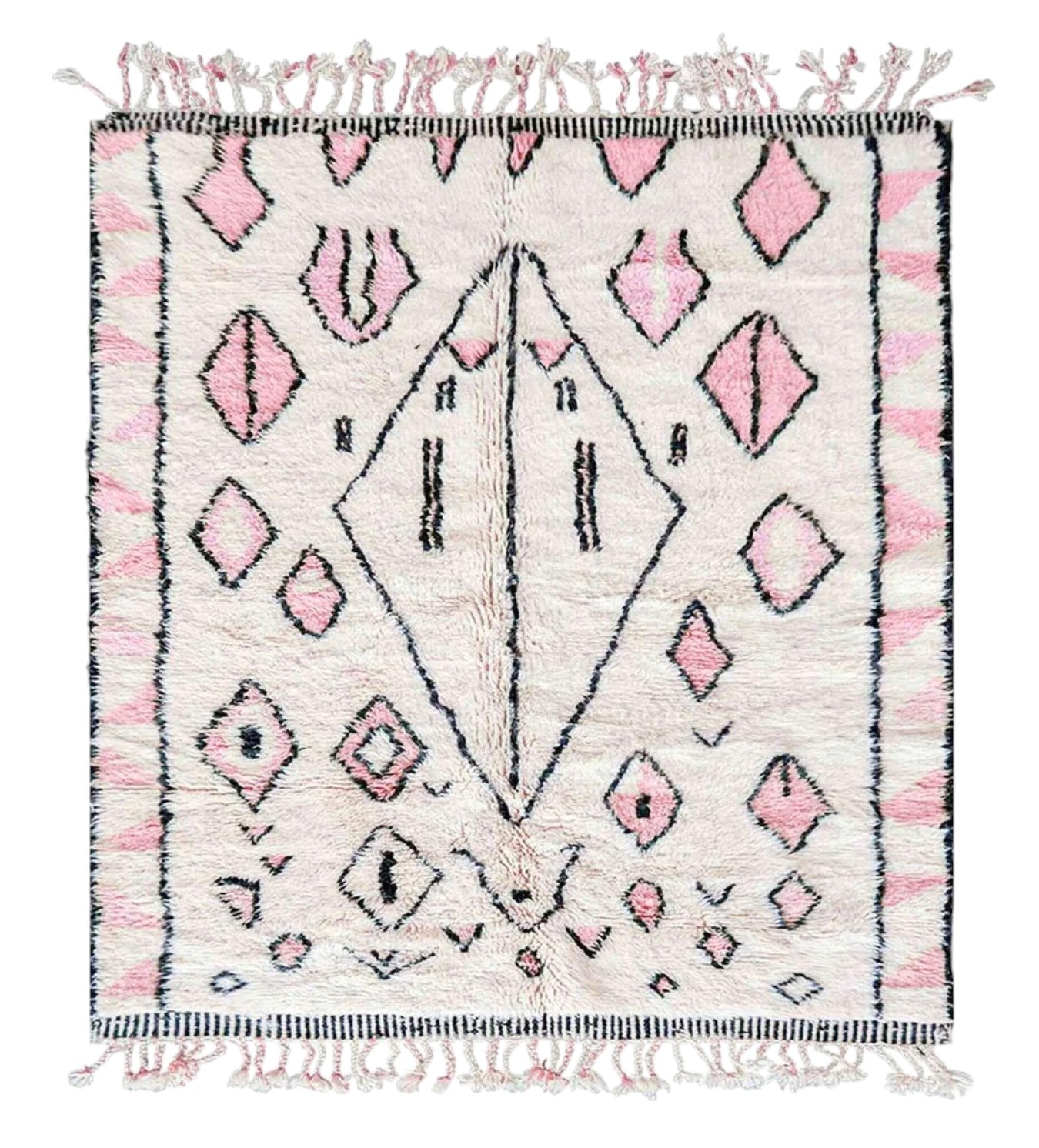 Handmade wool rug in soft white featuring pastel pink and black tribal geometric patterns, adorned with intricate fringe detailing, ideal for bohemian and modern feminine decor styles.