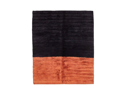 Handmade wool rug with bold horizontal stripes in deep black and terracotta orange, showcasing a sleek ribbed texture, ideal for modern and minimalist decor styles.