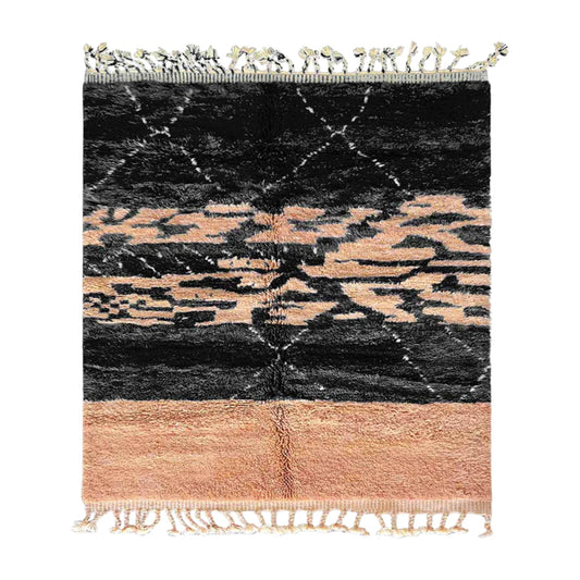 Handmade Moroccan wool rug featuring a bold black and peach abstract pattern with fringed edges, ideal for modern, boho, or eclectic interiors
