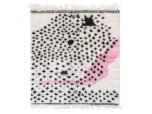 Handmade Moroccan wool rug featuring a bold dotted design in black and pink on a neutral cream base with fringed edges, perfect for bohemian, eclectic, or modern interiors
