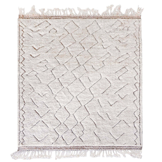 Handmade Moroccan wool rug in cream with a minimalist geometric line pattern, finished with decorative fringes, creating a timeless and elegant piece for modern, boho, or Scandinavian interiors