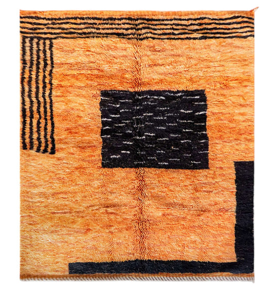 Handmade Moroccan wool rug with a bold orange base and black geometric patterns, ideal for modern, eclectic, or industrial interiors, featuring a contemporary design with sleek lines
