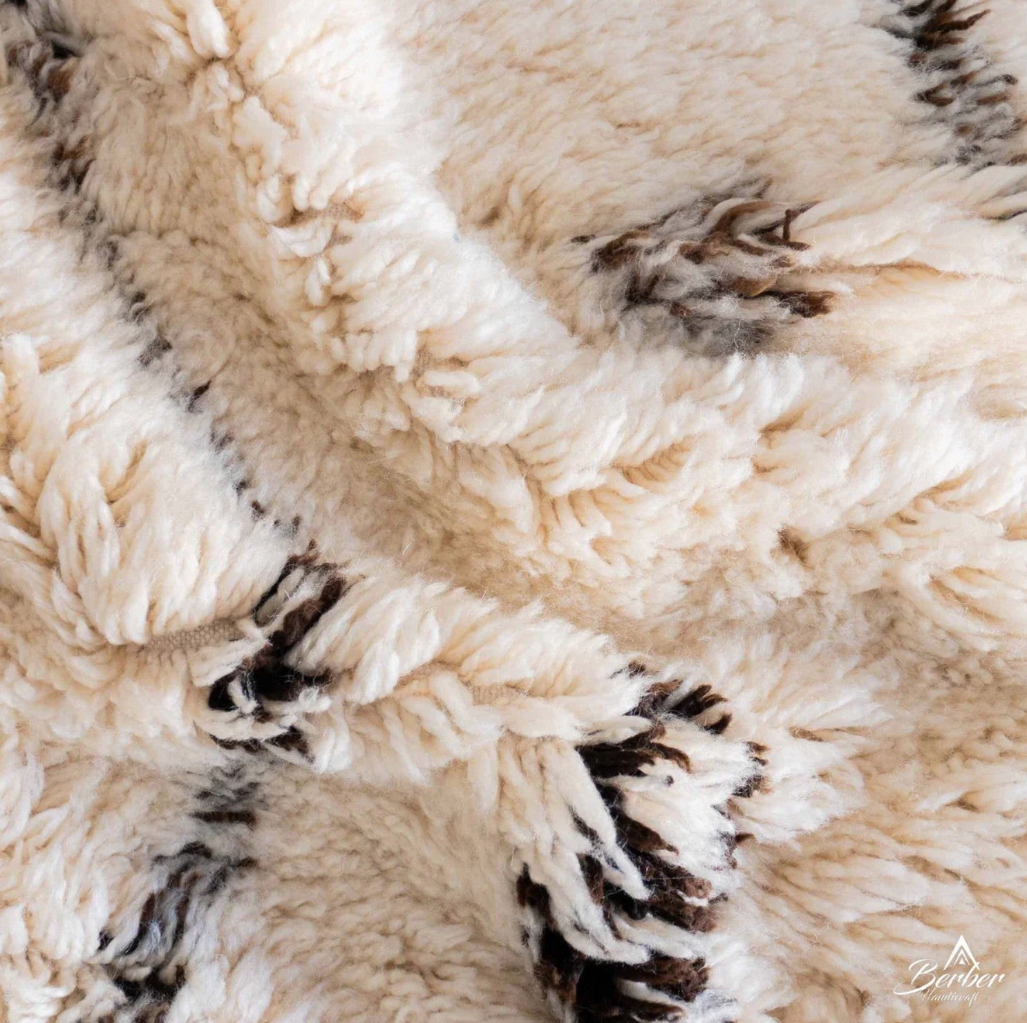 Handmade Moroccan wool rug with a cream base, black zigzag lines, and subtle Berber motifs, perfect for minimalist, boho, or Scandinavian interiors
