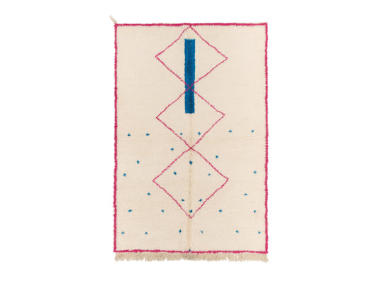 Ivory Moroccan rug with pink diamond pattern and blue accents, featuring a bold blue bar across the design. This handmade rug adds a colorful boho touch to living rooms, bedrooms, or office spaces.
