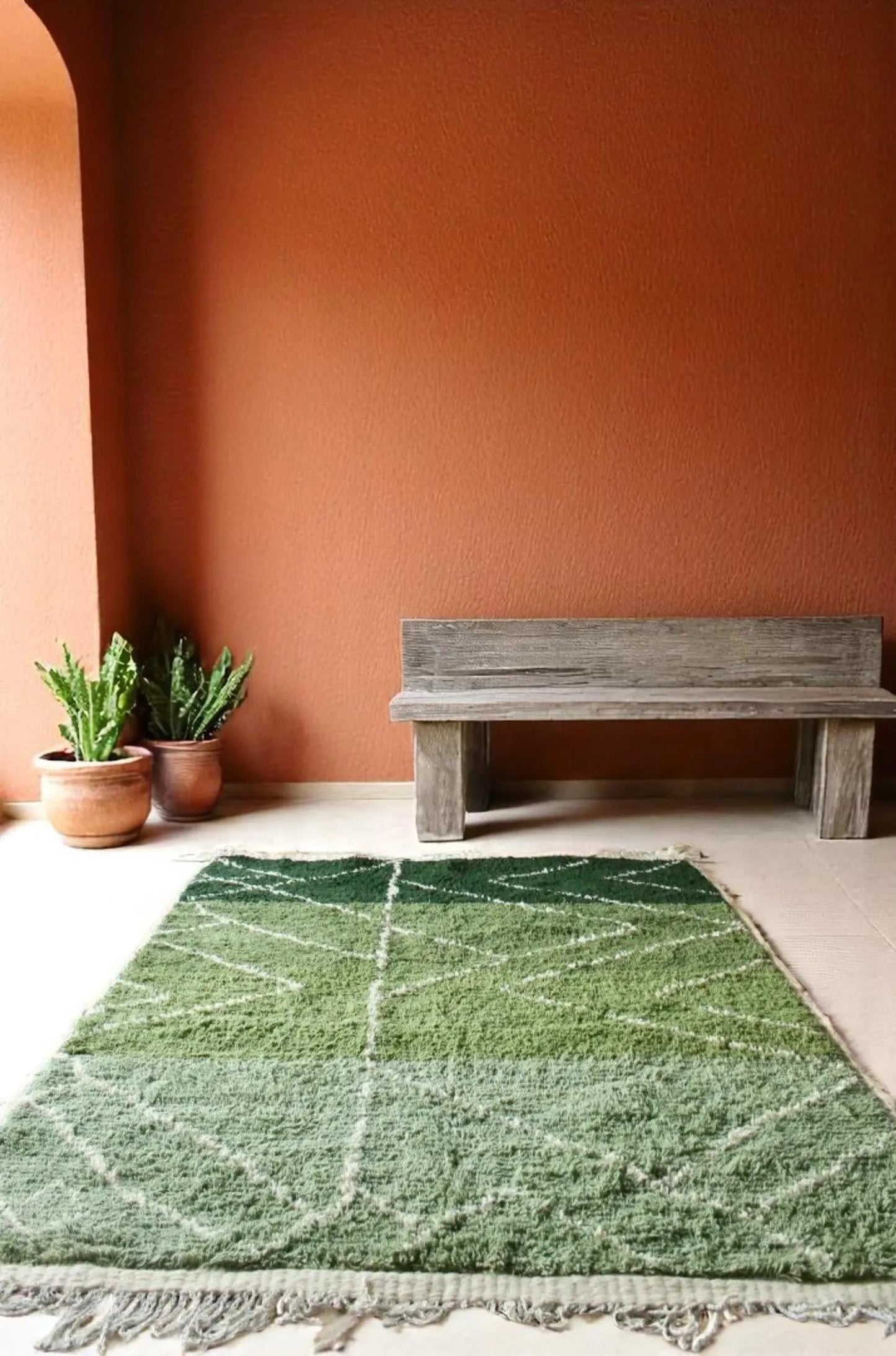 Handmade Moroccan rug in rich green shades with white diamond geometric lines. This Berber wool carpet is woven by skilled artisans using traditional Moroccan techniques, making each rug unique. Its fresh green tones bring life, balance, and a calming natural touch to interiors. Perfect for living rooms, bedrooms, and creative spaces, this eco-friendly wool rug blends tribal heritage with modern bohemian style for timeless Moroccan elegance.